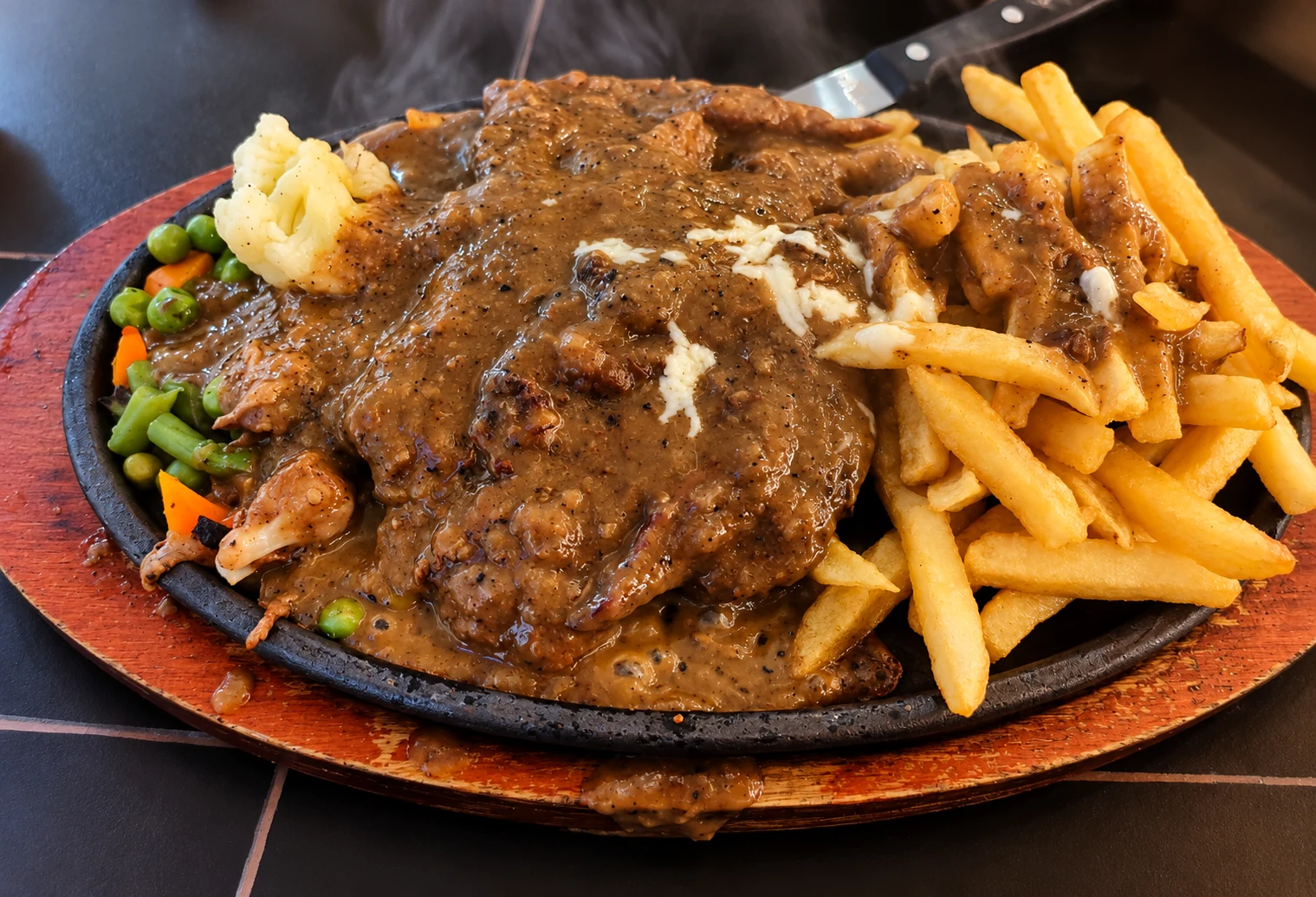 Bali’s actual Pepper Steak Sizzler, professionally enhanced from its original serving photograph